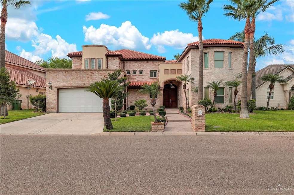 Mediterranean / spanish-style house featuring a tiled roof, concrete driveway, a front yard, and stucco siding