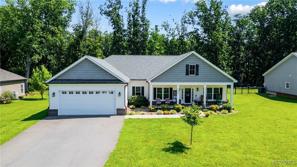View of front facade featuring driveway, covered p