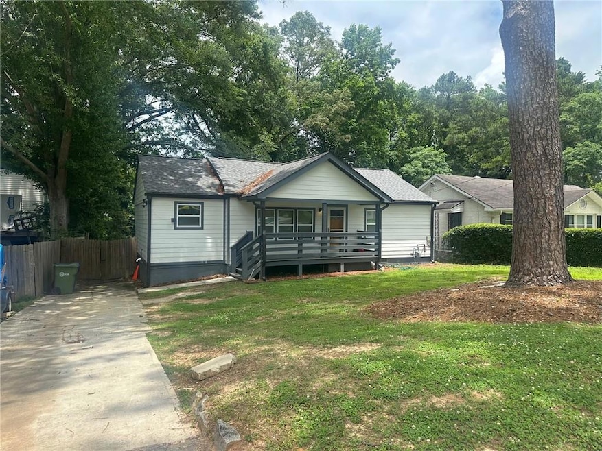 View of front of home with covered porch and concrete driveway