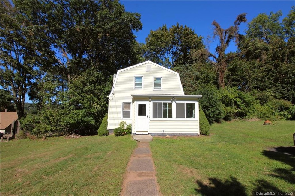 Gambrel Colonial nicely situated back off the main