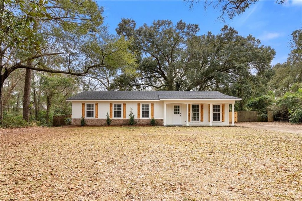 Single story home featuring covered porch