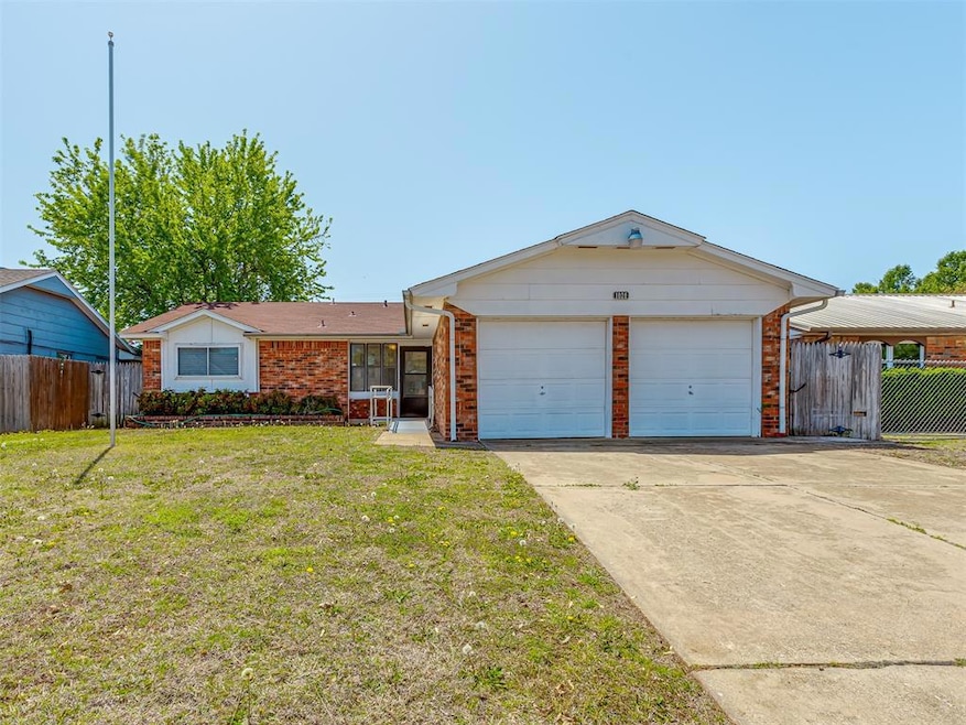 Single story home with concrete driveway, a front 