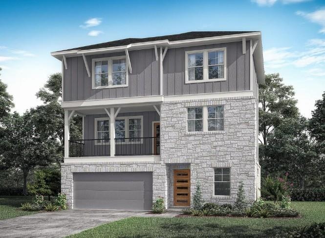 View of front of home featuring a garage, board a