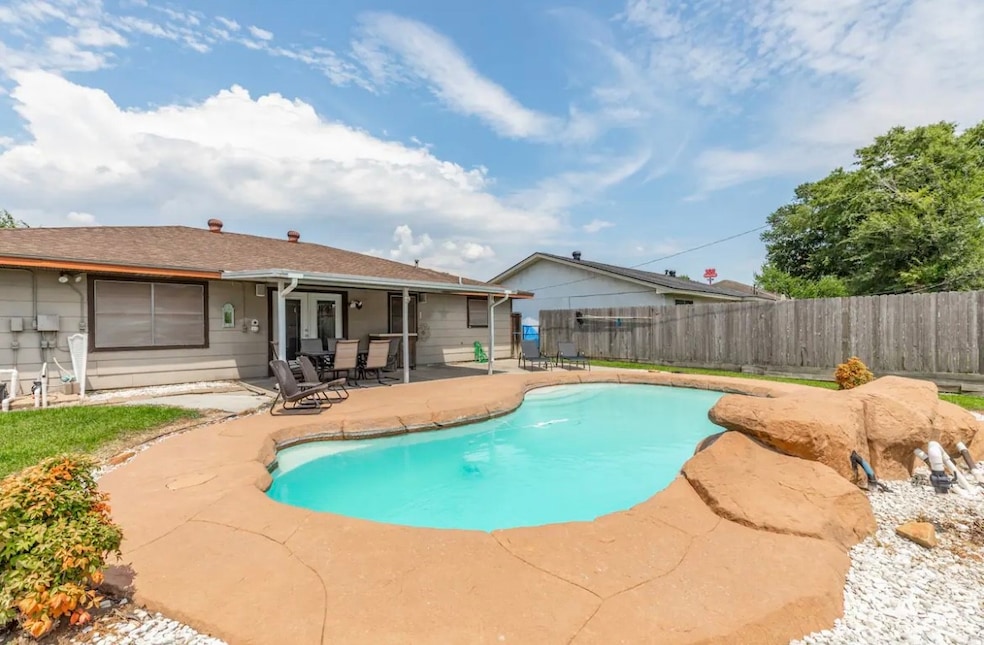 Backyard with underground pool with pool heater