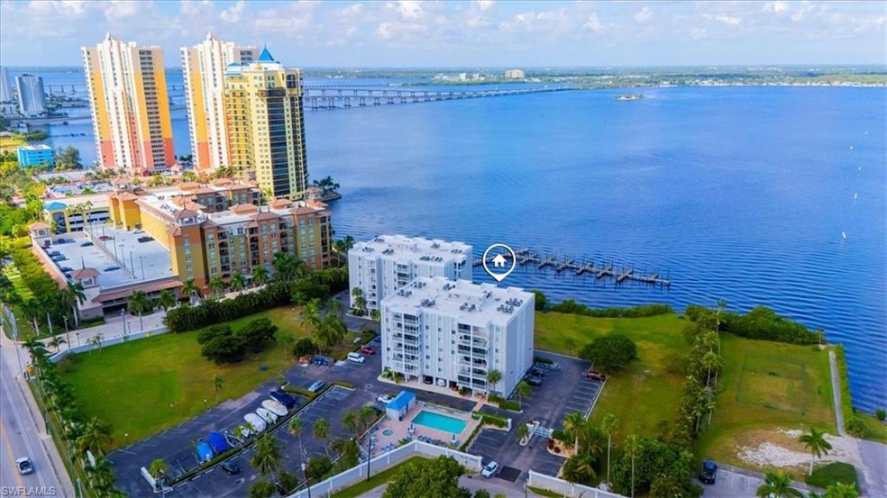 Aerial view of a nearby body of water and a notable bridge
