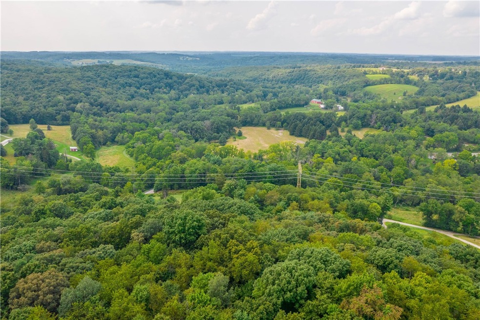Property nestled in wooded trees.