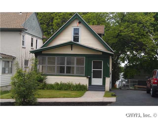 Exterior Front. Freshly painted trim, enclosed por