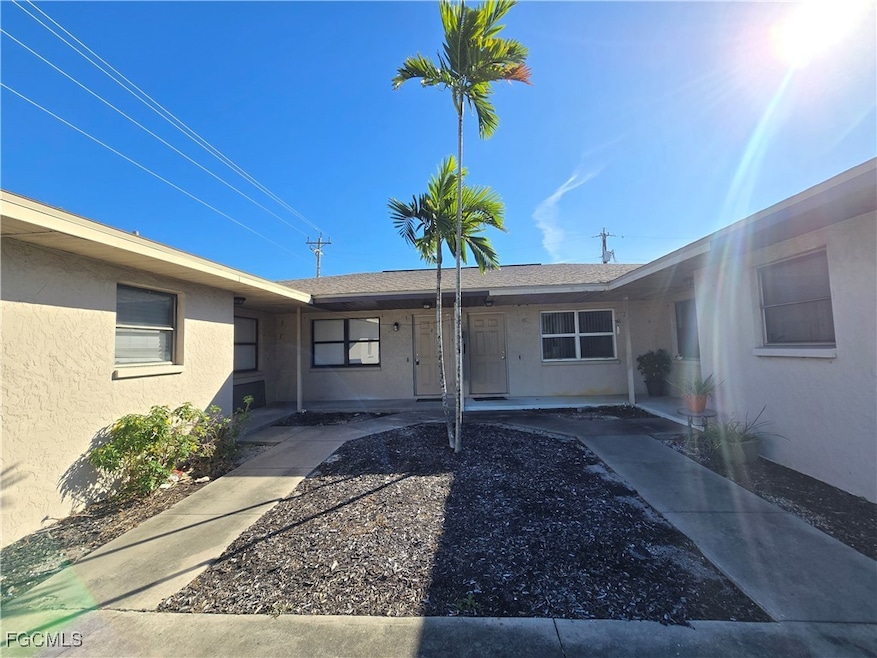 Property entrance with stucco siding