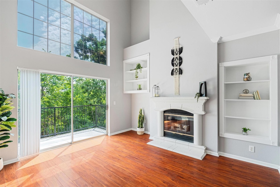 Unfurnished living room with a high ceiling, wood