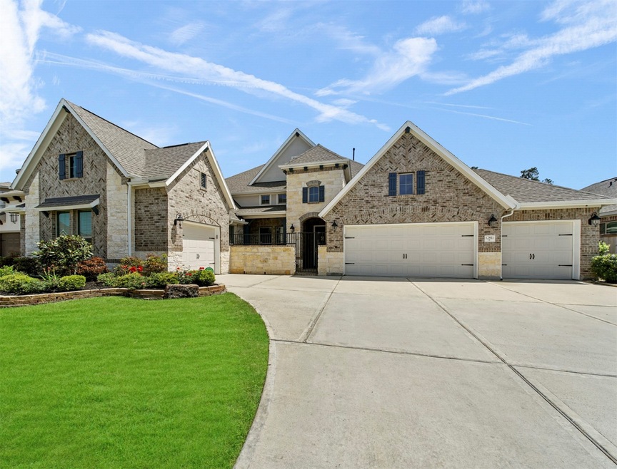 Welcome to this beautiful brick and stone one story home with 4  car garages!  Exterior cameras included for your safety.