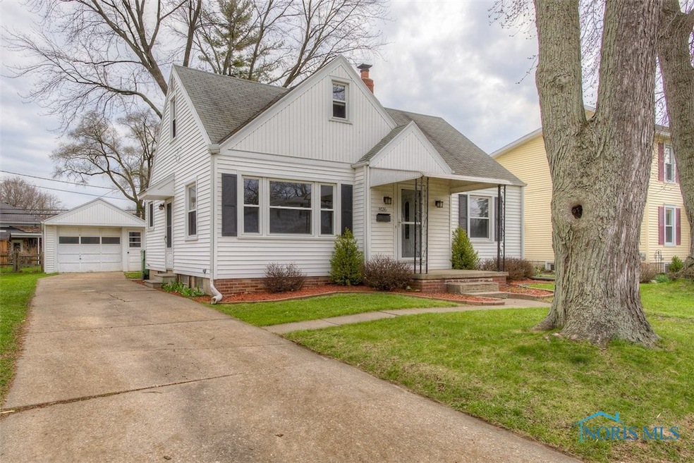 Front of home with concrete driveway and insulated