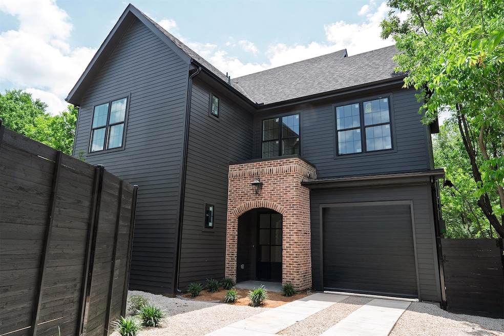 View of front of property with brick siding, an a