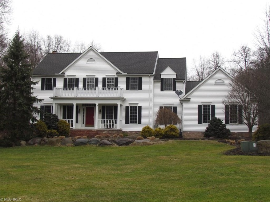 Stately colonial secluded on 3.7 wooded acres