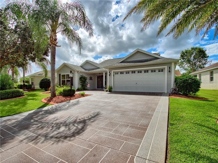 AMAZING CURB APPEAL WITH CUSTOM PAINTED DRIVEWAY, 
