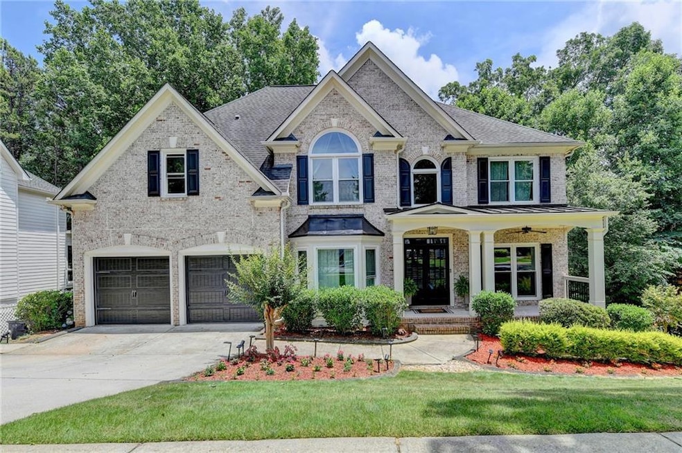View of front of property featuring a garage and a