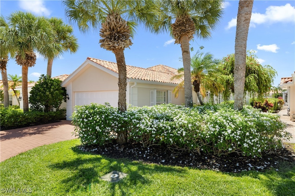 View of property exterior with stucco siding, a ga