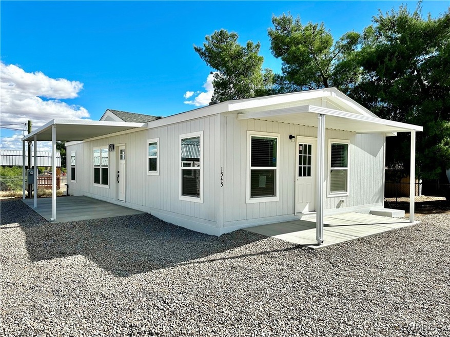 Front of home showcasing the covered patios.