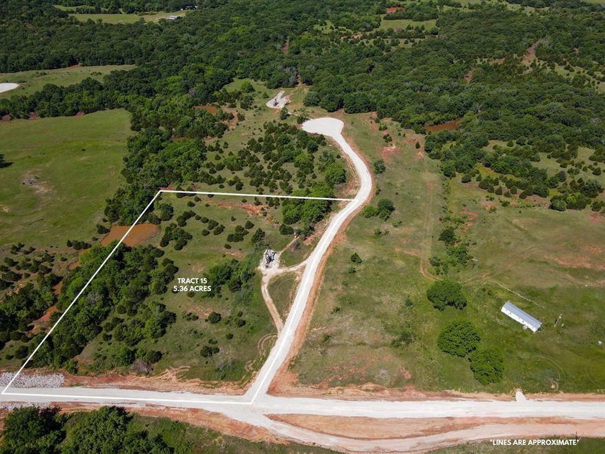 View of property location featuring property parcel outlined and a heavily wooded area