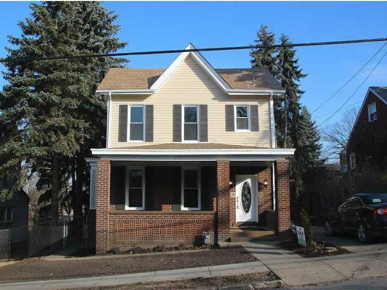 Exterior Front. Big front porch...brick & new viny
