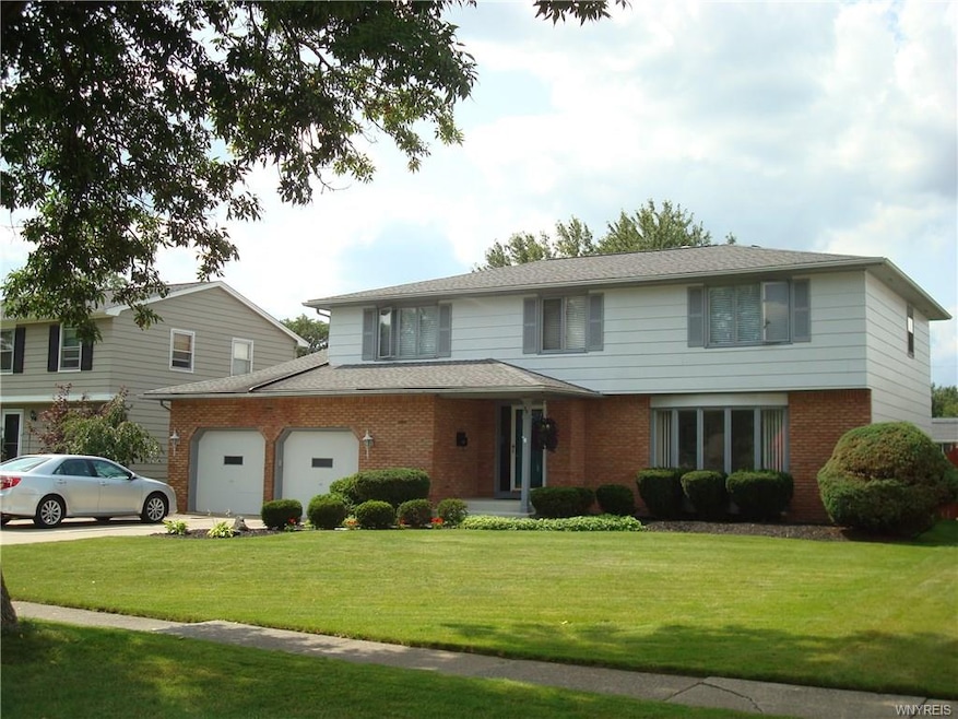 Brick and frame 2 story colonial features bay wind