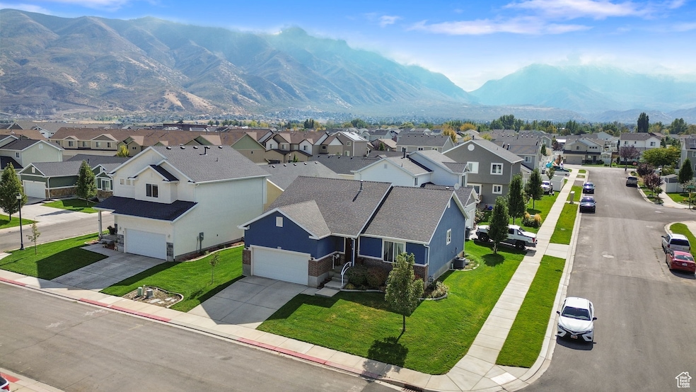 Aerial perspective of suburban area with a mountainous background