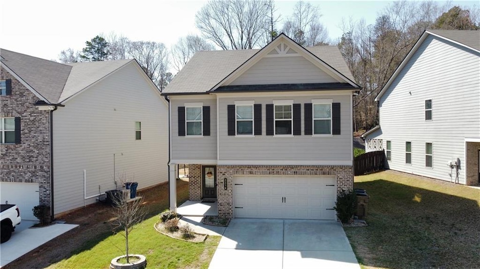 View of front of property with an attached garage,