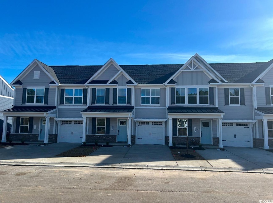 View of property with a garage