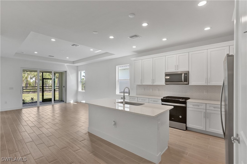 Open-concept floor plan with kitchen and great roo