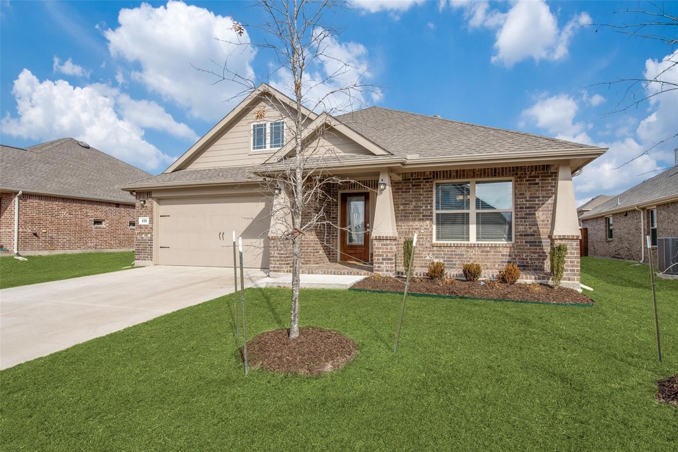 Craftsman house with a garage, central AC, and a front yard