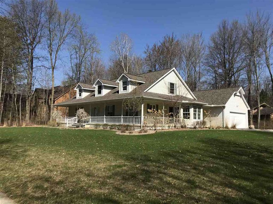 Wrap around front porch, with side load garage and