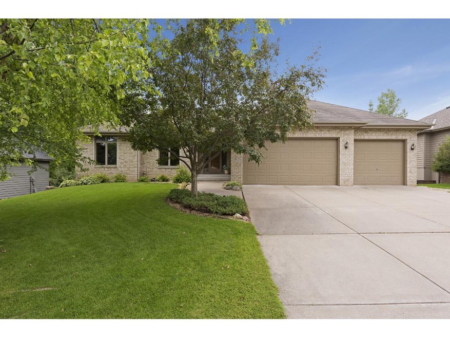 Impressive Curb appeal with warm Brick front, conc