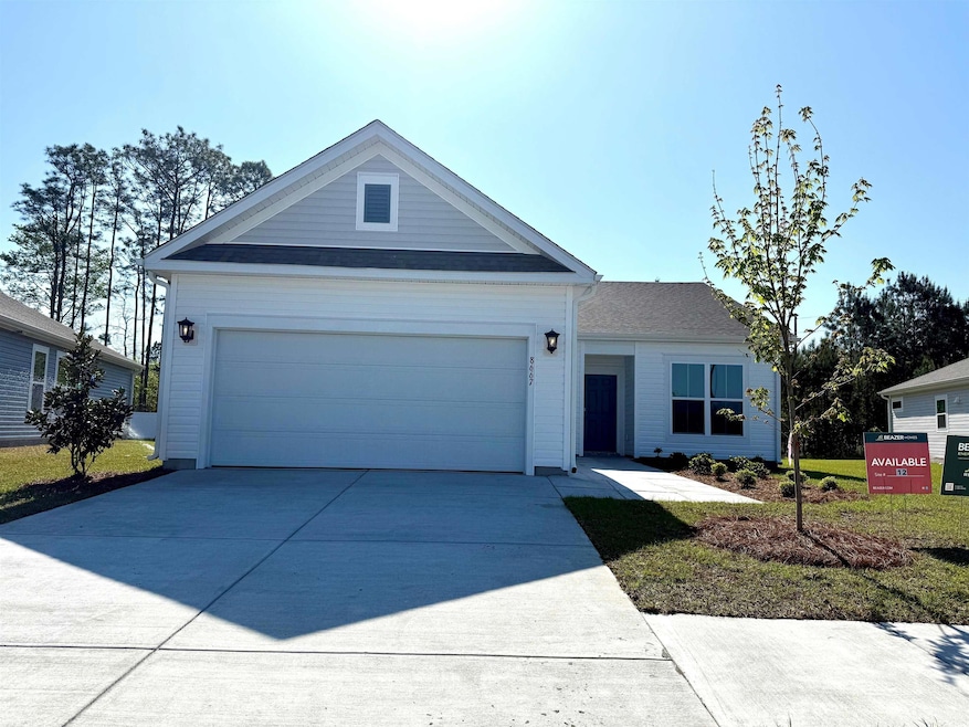Single story home with an attached garage and driv