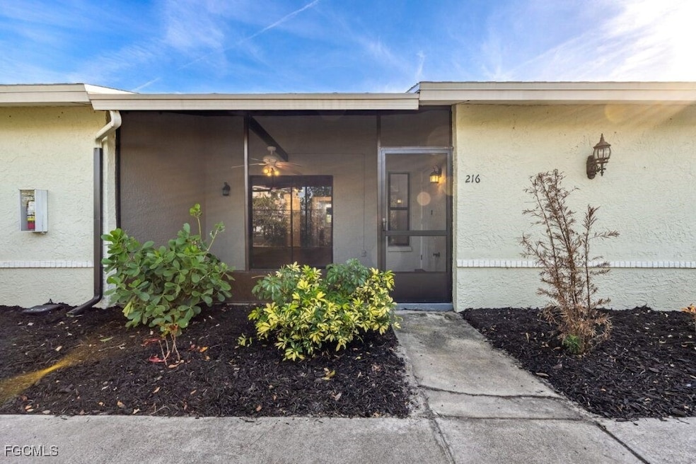 Property entrance featuring stucco siding