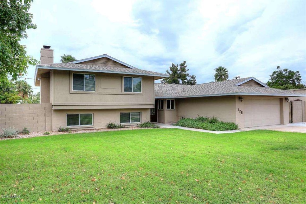 Front of Home with grassy front yard