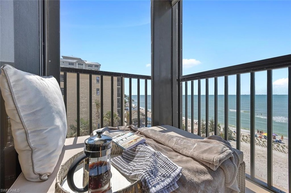 Balcony featuring a water view and a view of the b