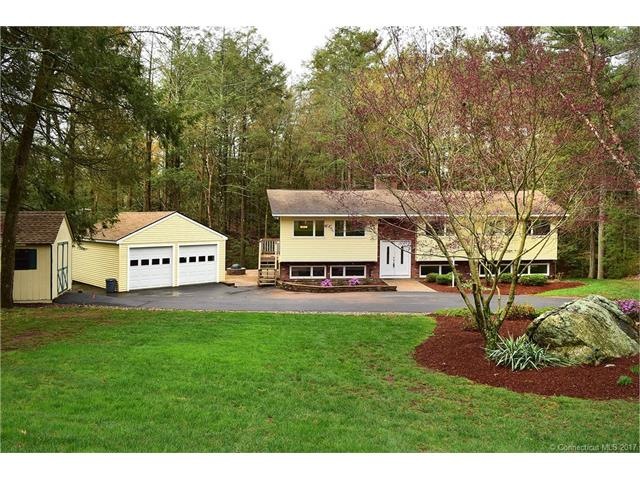 The updated Raised Ranch sits on a picturesque 1.4