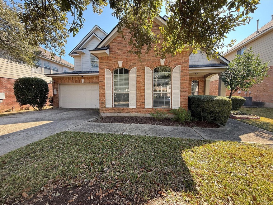 Front of home with an extra long driveway that easily fits 4 cars
