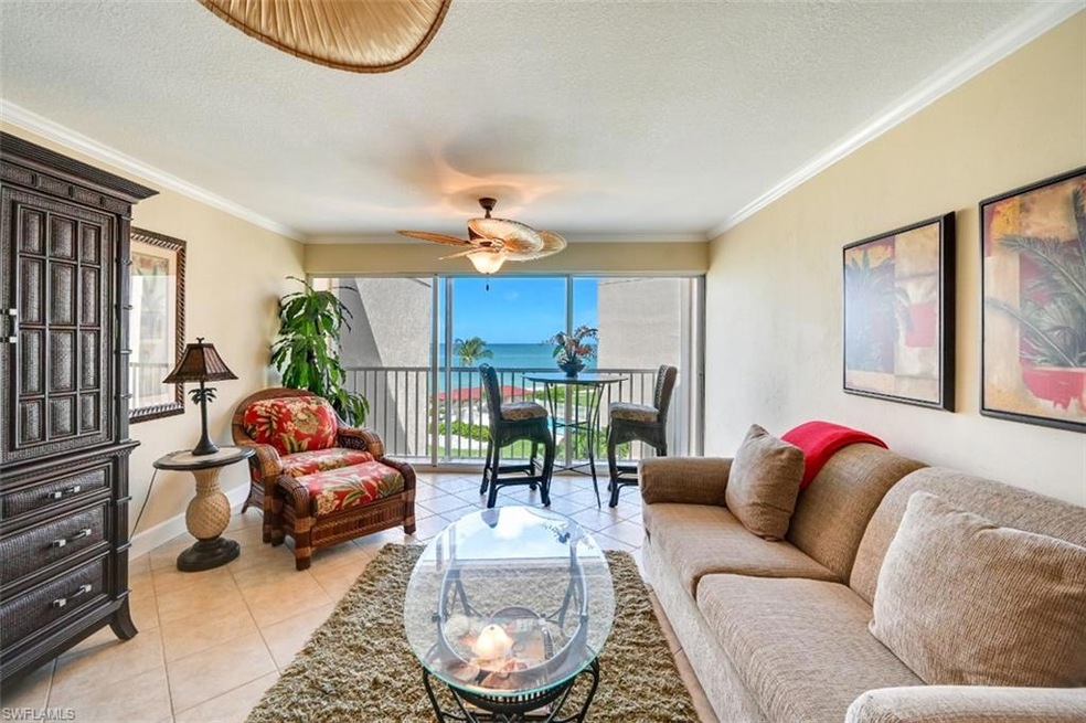 Sunroom featuring a water view