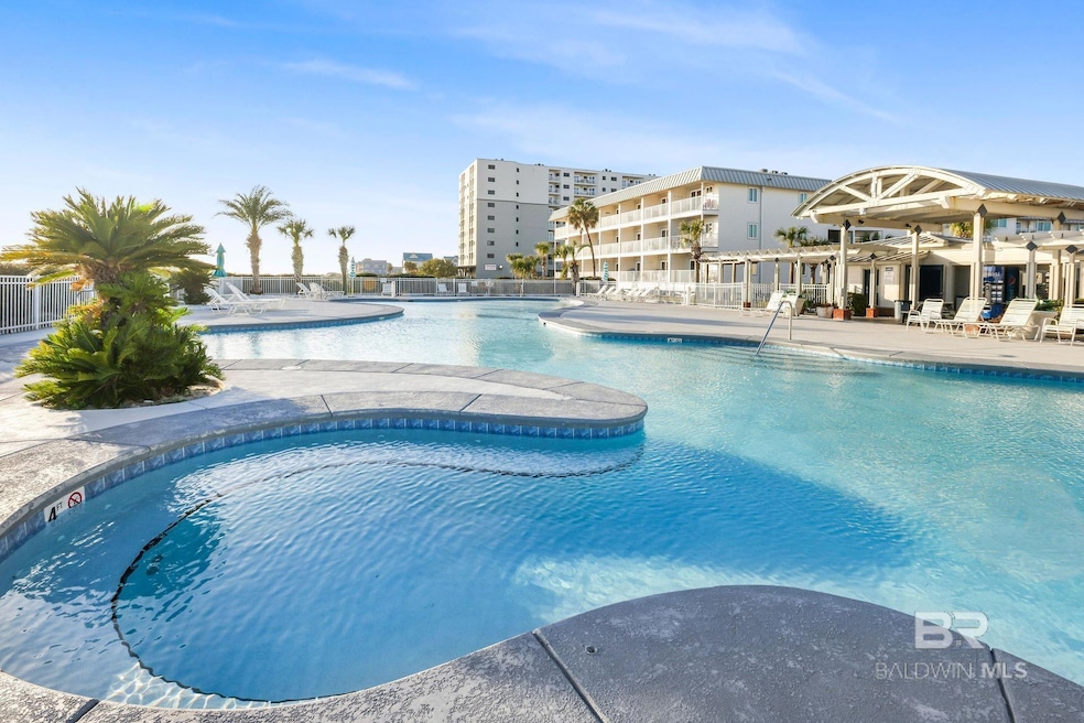 Community pool with fence and a patio area