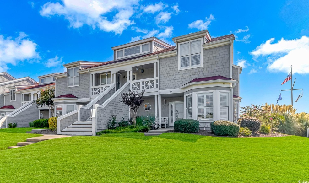 View of front of home featuring a porch and a fron