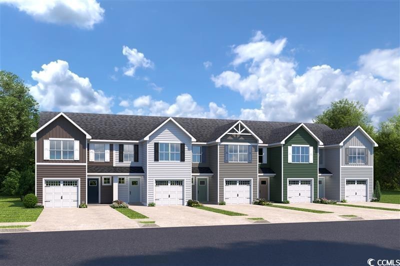 Townhome / multi-family property with driveway and