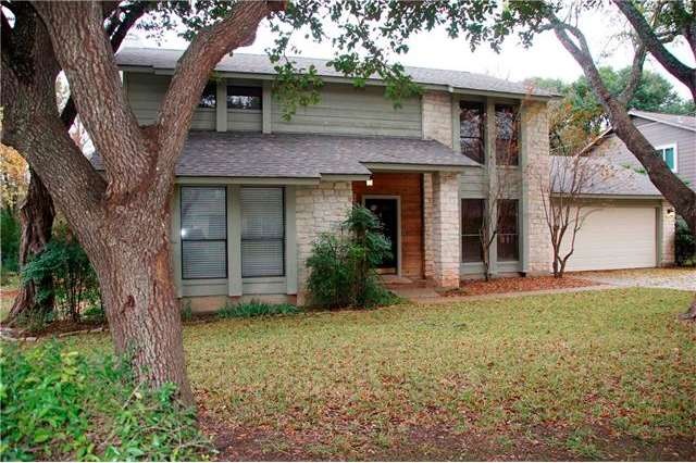 Texas limestsone front, with cedar siding in a sha