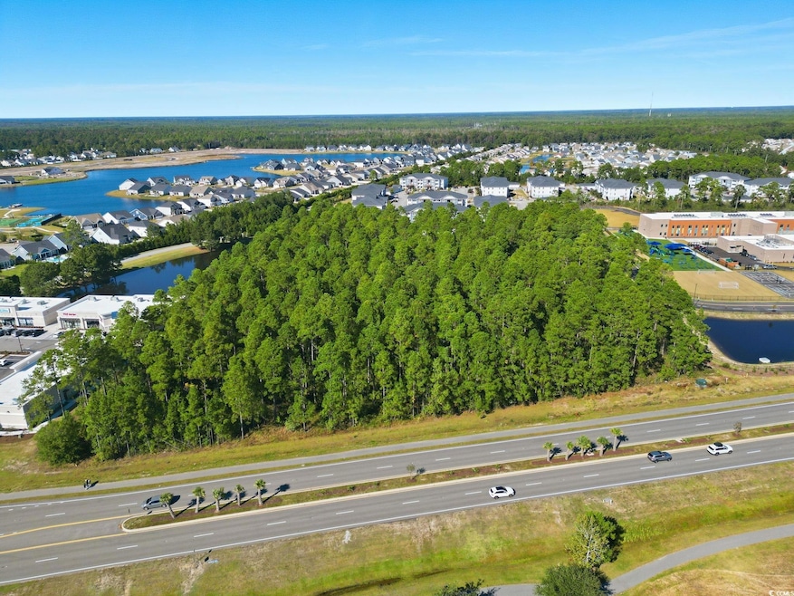 Aerial view of residential area featuring a large body of water
