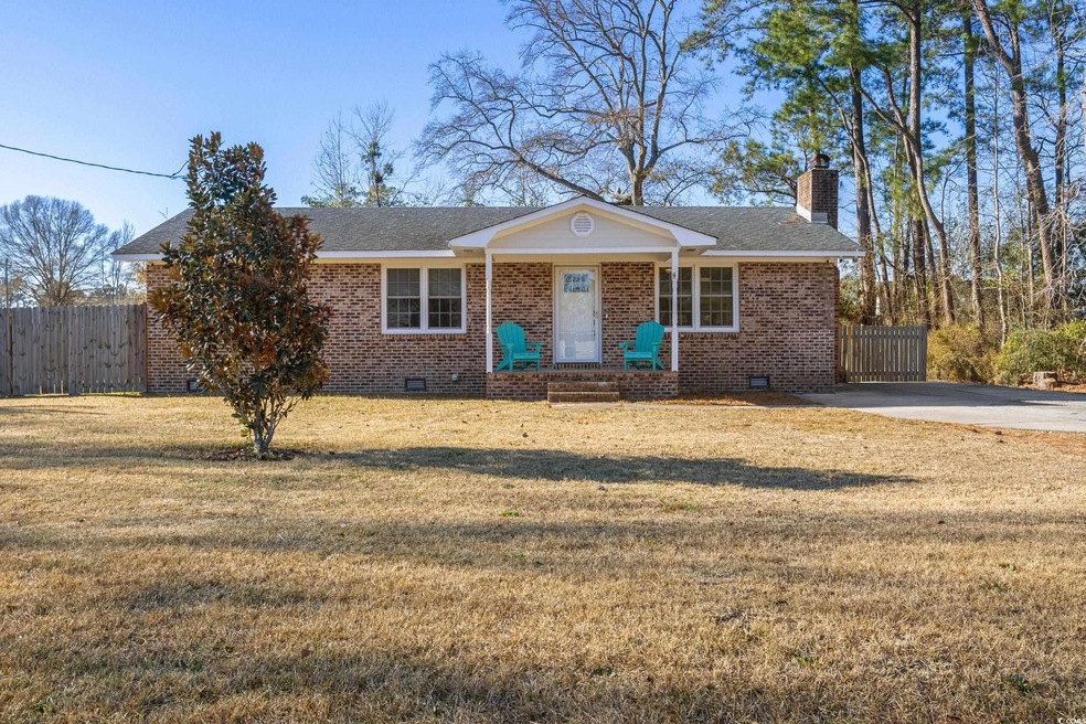 Ranch-style house with a front lawn