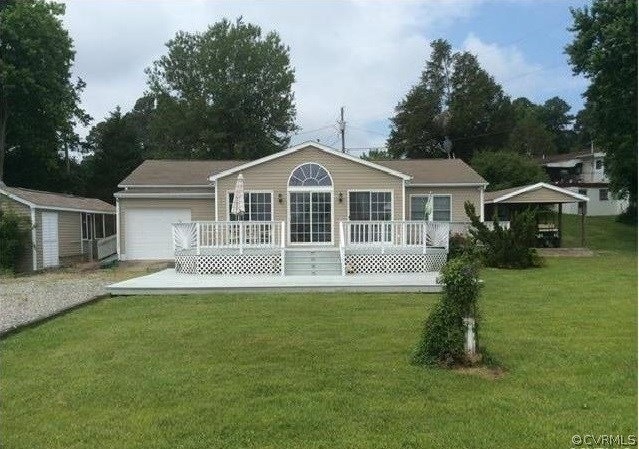 125 Sandy Beach Rd, Dunnsville, VA 22454 - photo 1