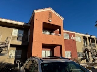 View of property with stairway