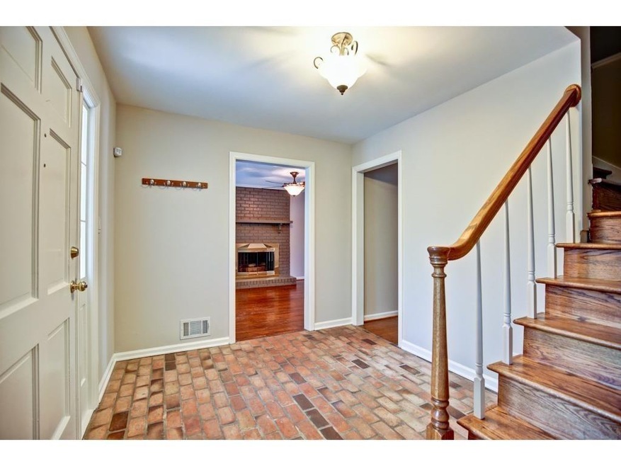 Welcome home-beautiful exposed brick foyer opens t