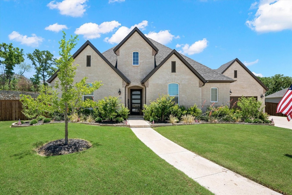 This elegant estate home features a charming front