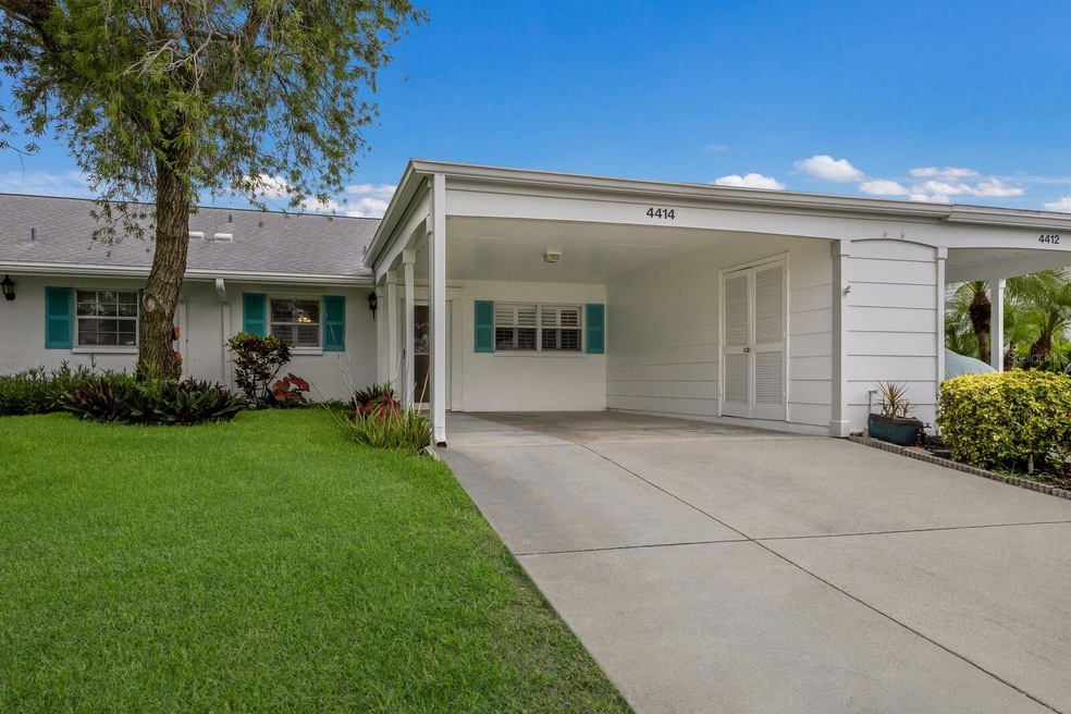 Front entrance with extra wide carport and storage