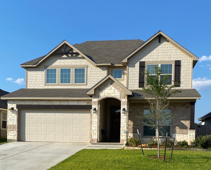 Craftsman house featuring a shingled roof, stone s